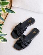 Black criss-cross flat slide sandal with contrast stitching by Clarashoe